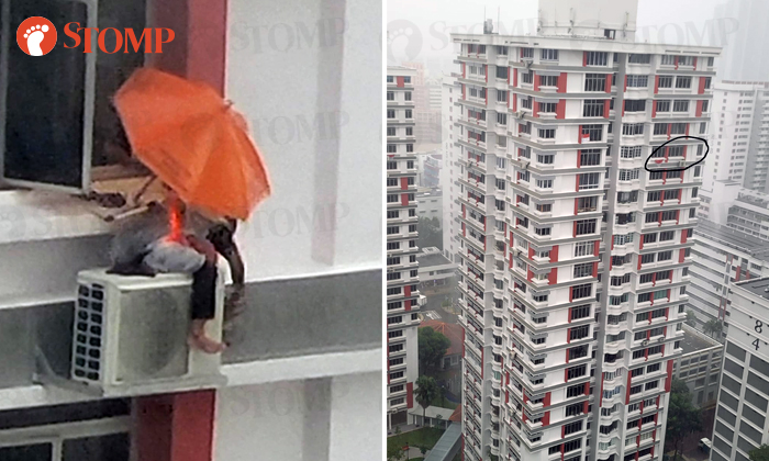 person working 21st floor air-con compressor during storm