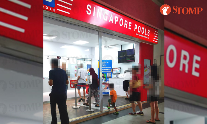 singapore lottery women bringing child